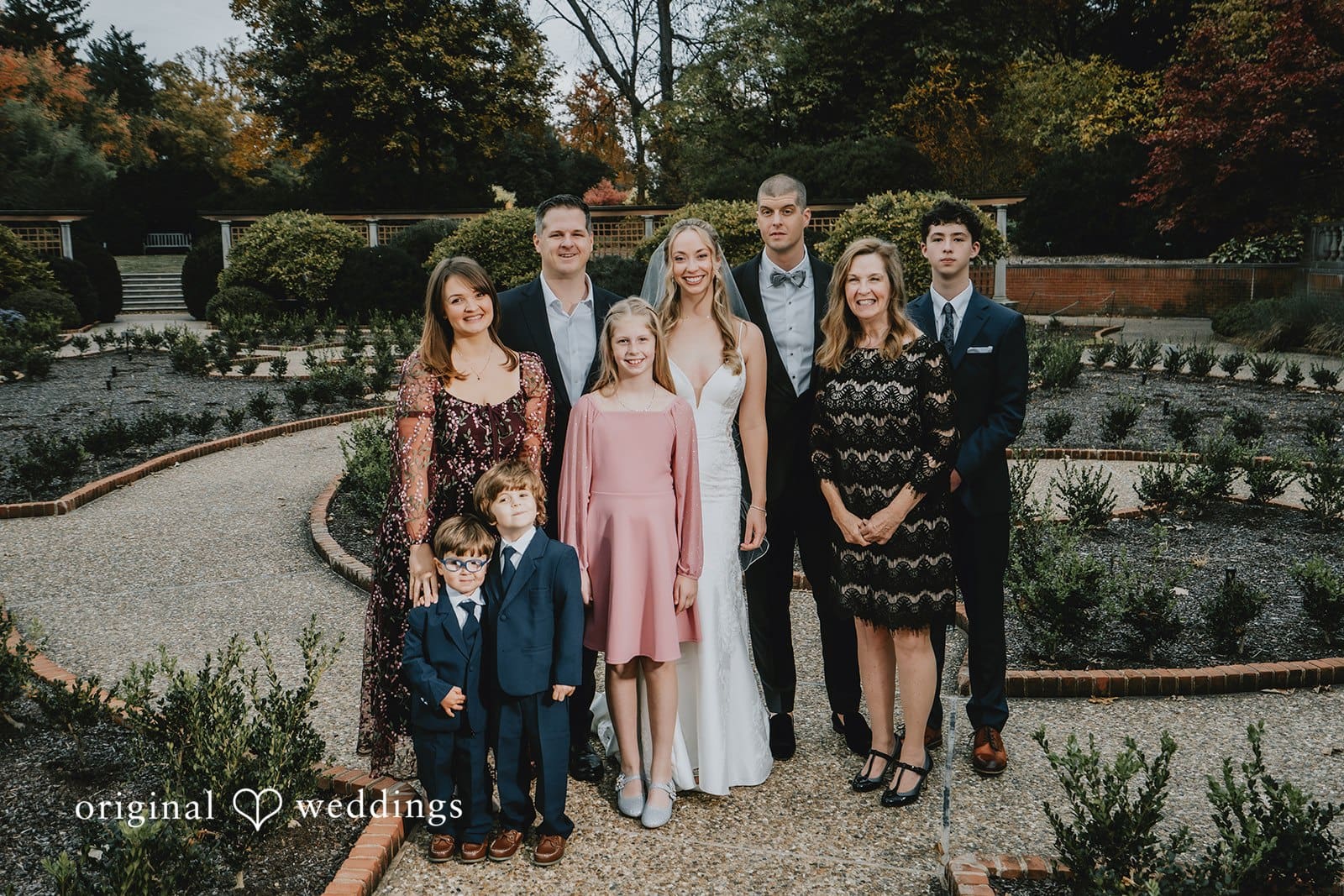 A portrait of the couple with family at St. Louis Botanical Gardens