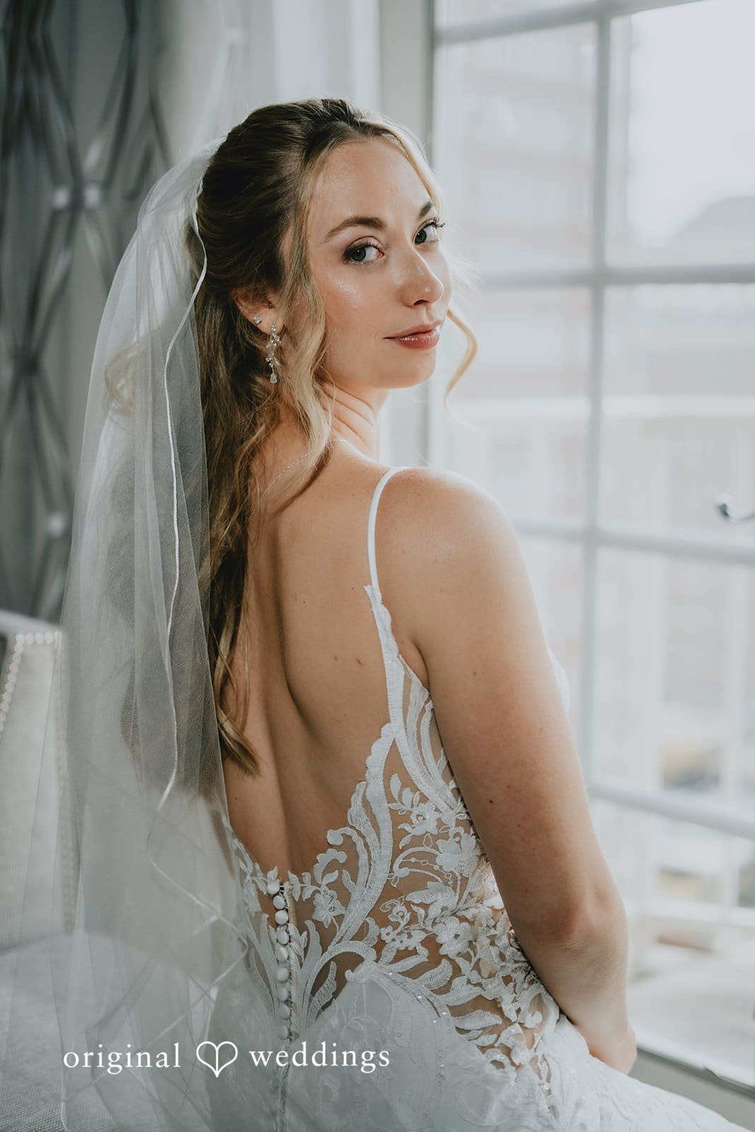 A stunning side-view portrait of the bride before the wedding ceremony