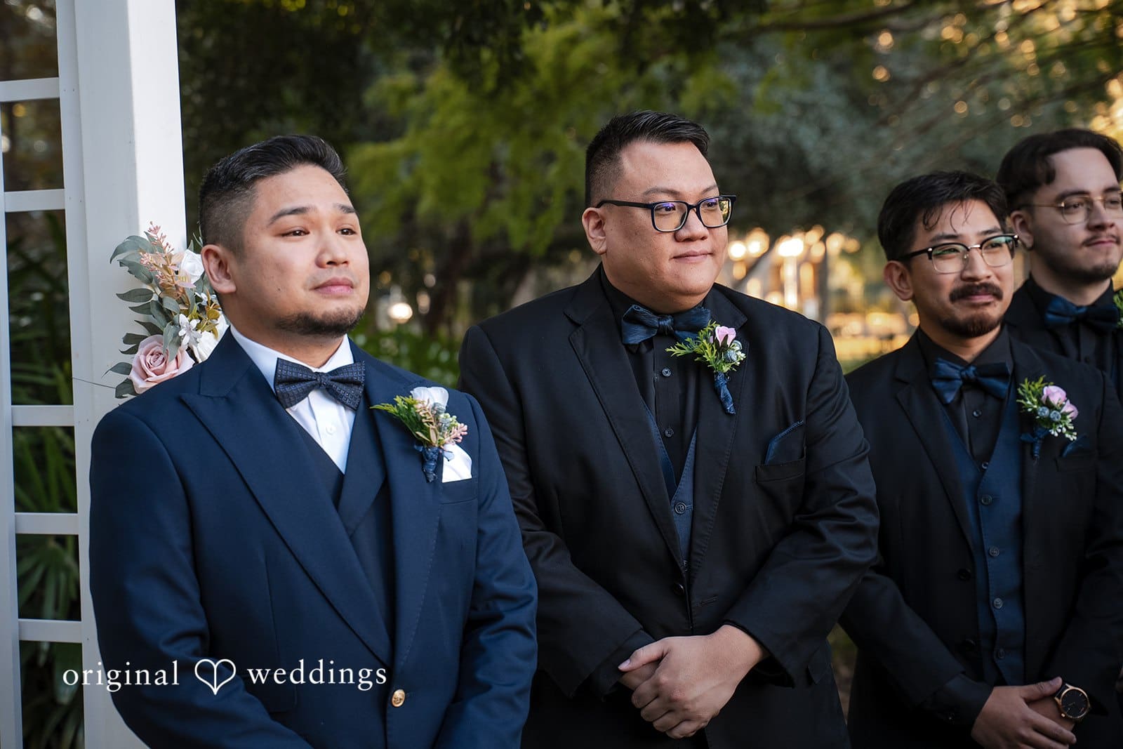 Groom waiting with his groomsmen at the altar during the outdoor ceremony at Tampa Garden Club
