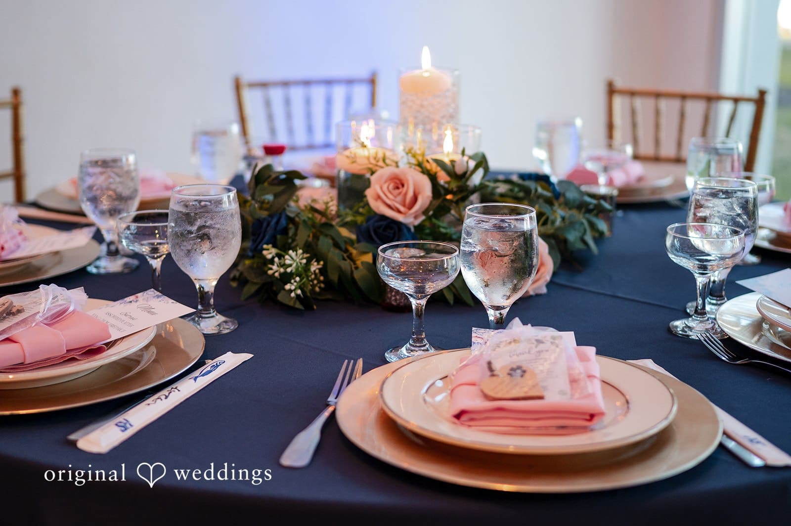 Elegant wedding reception table with pink flowers and place settings at Tampa Garden Club