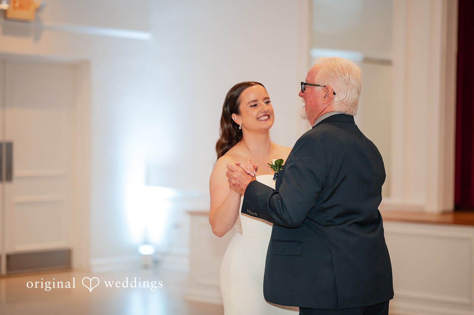 Bride dancing with her father during an emotional reception moment