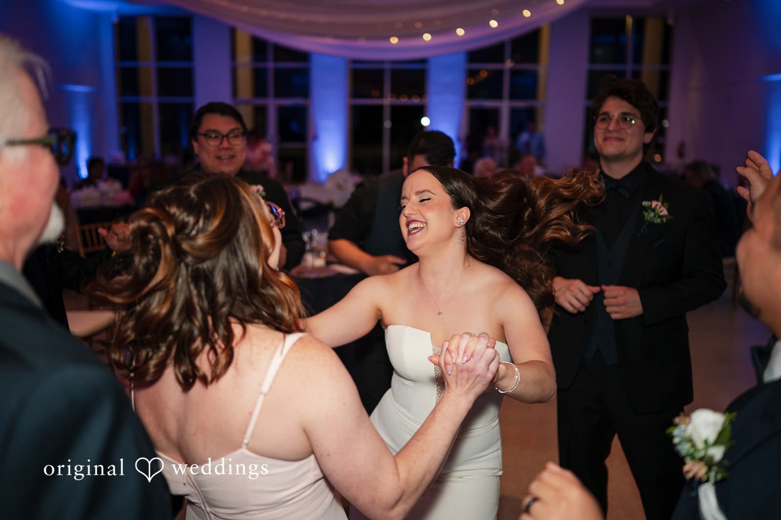 Bride dancing with her bridesmaids during the reception party