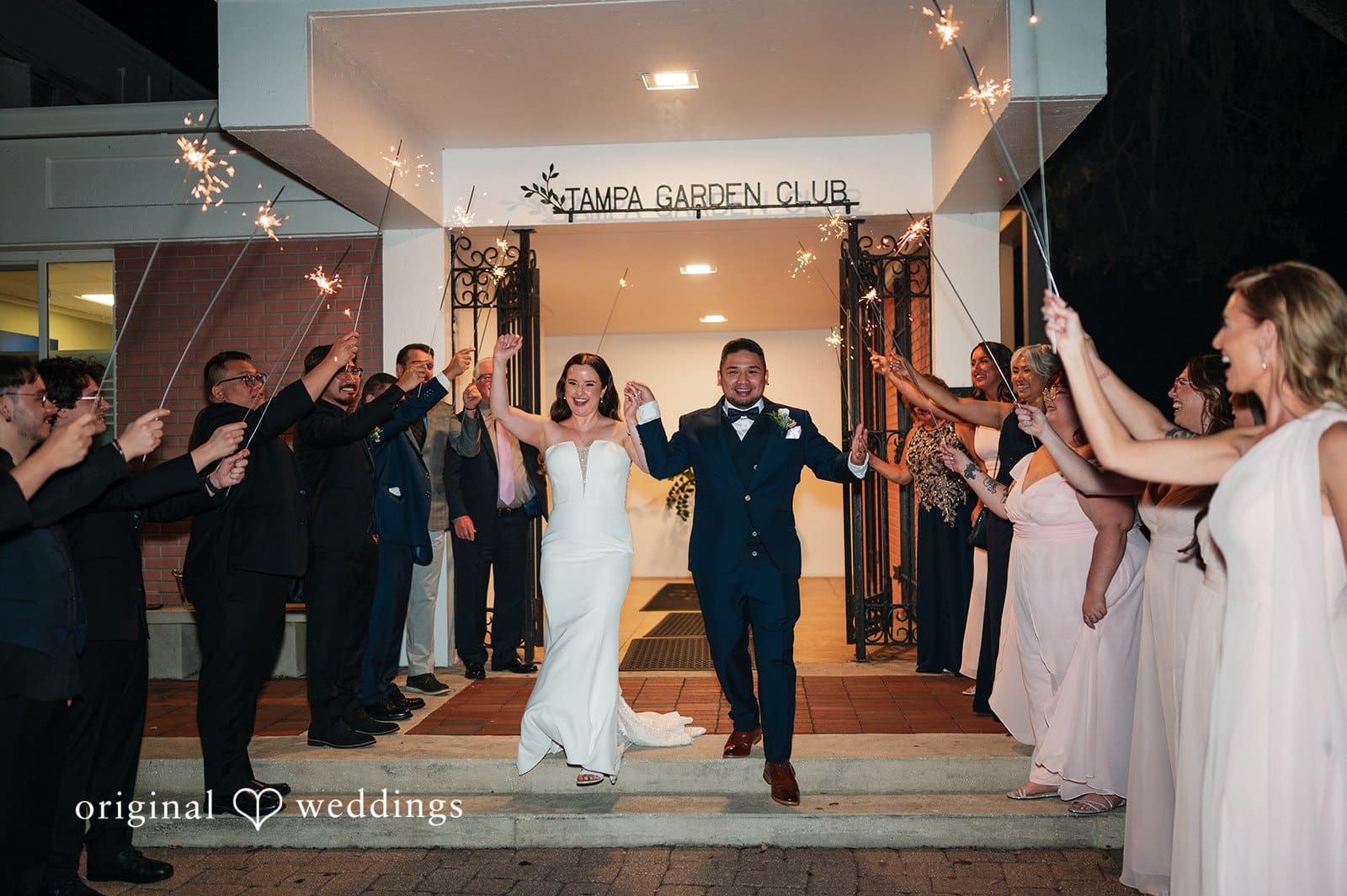 Bride and groom exit with sparklers at Tampa Garden Club