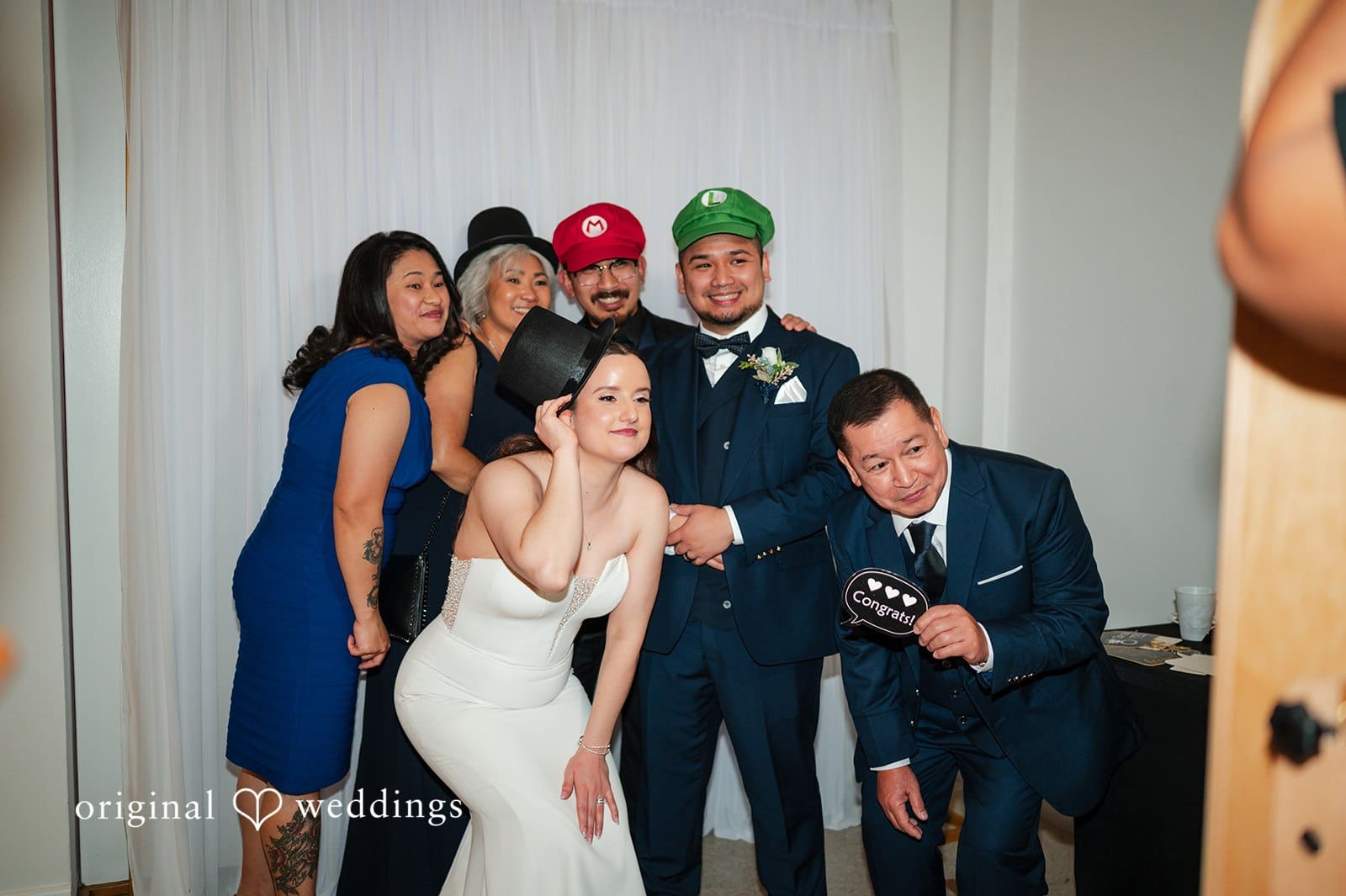 Guests and the bride and groom taking fun photos together