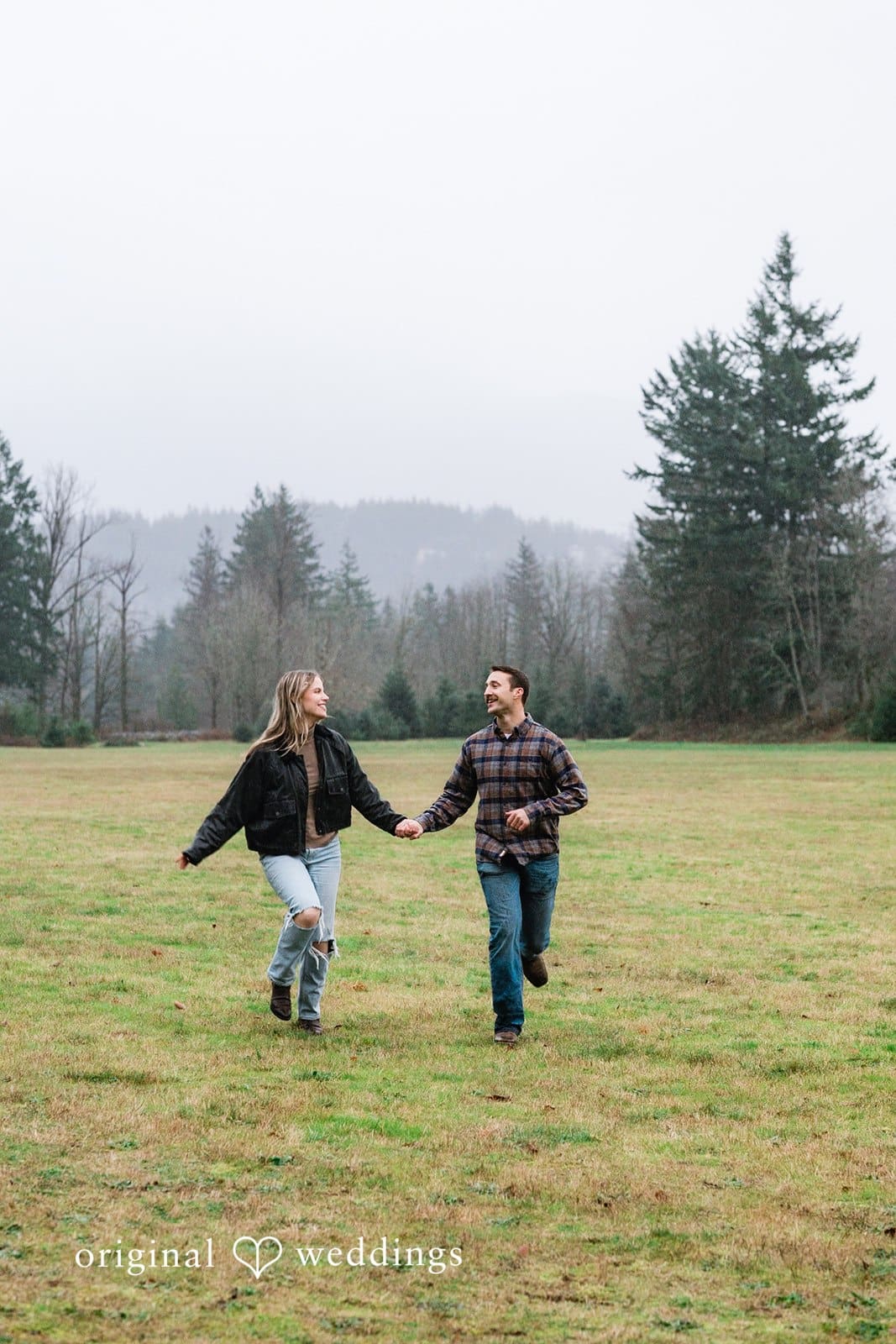 The couple running through the field