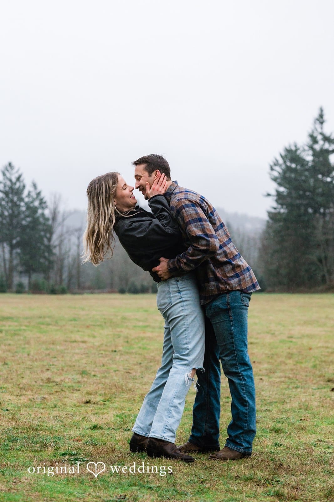 A romantic portrait of the couple in the field