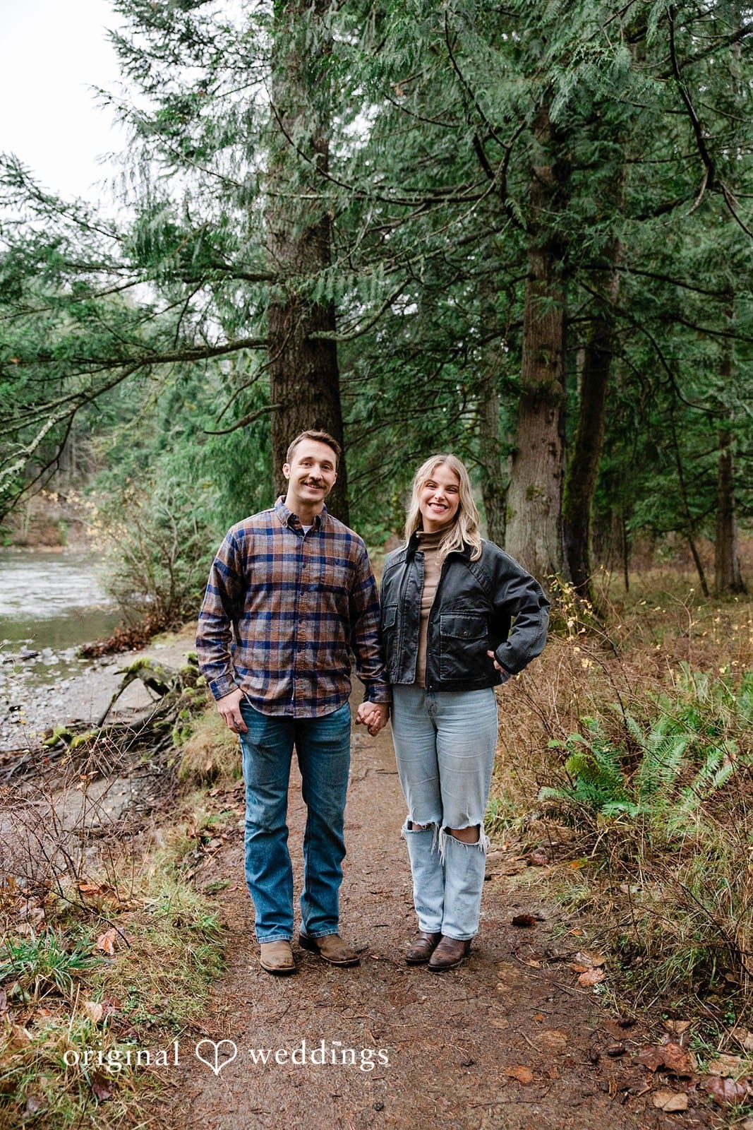 A stunning portrait of the couple by the river at Tanner Landing Park
