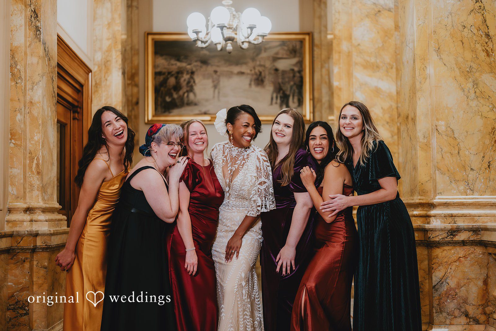 A joyful portrait of the bride and her bridesmaids