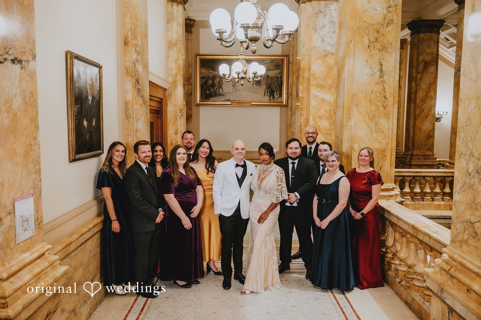 Our Milwaukee wedding photographers at Original Weddings captured a beautiful portrait of the couple with their bridal party at The Cooperage