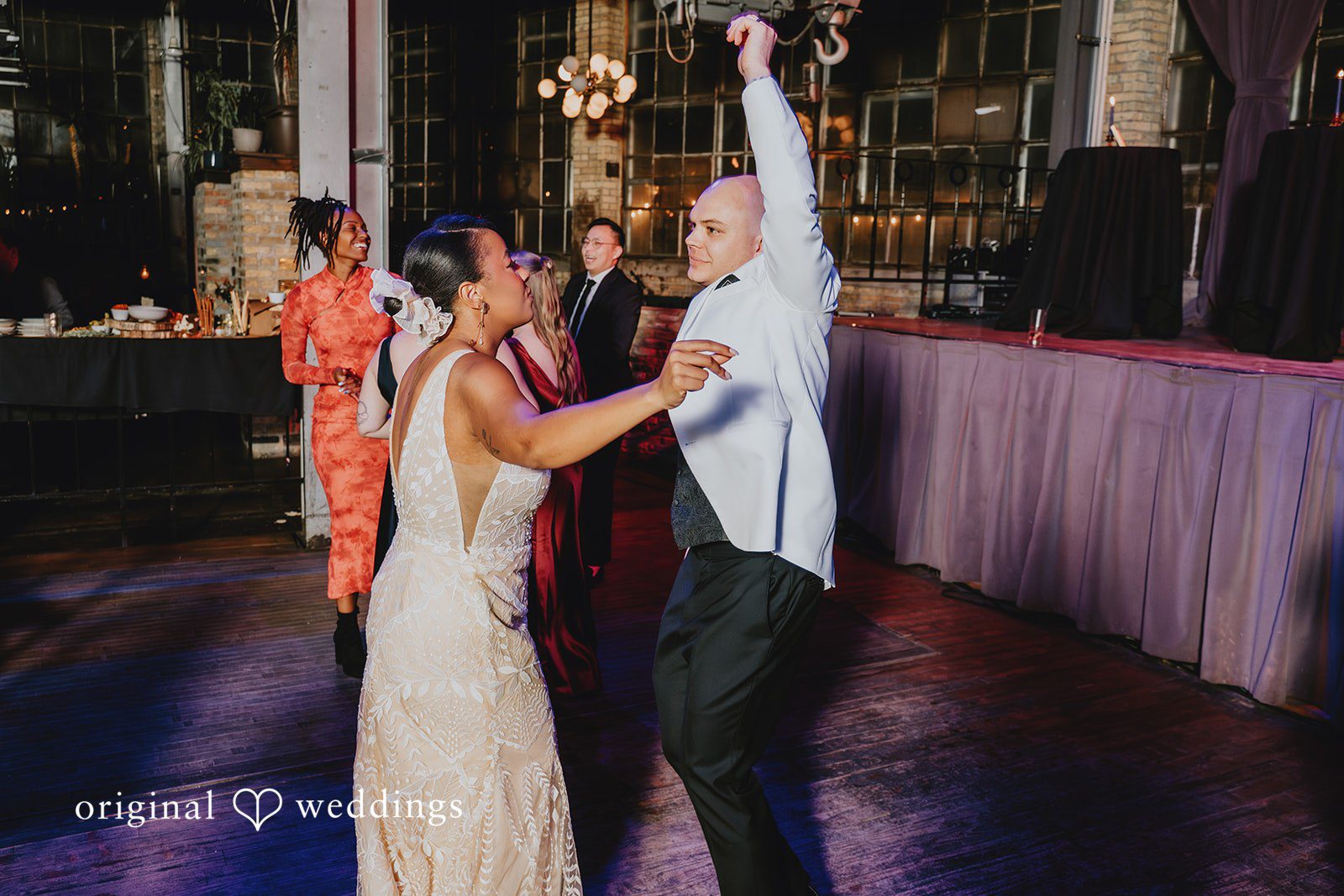 The couple dancing happily at their wedding reception
