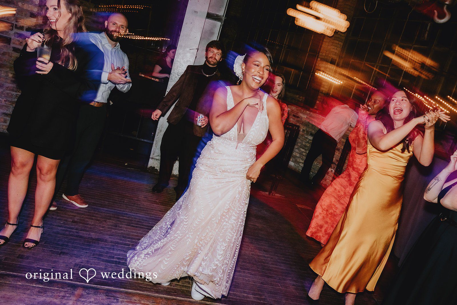 Joyful bride dancing happily at her wedding party