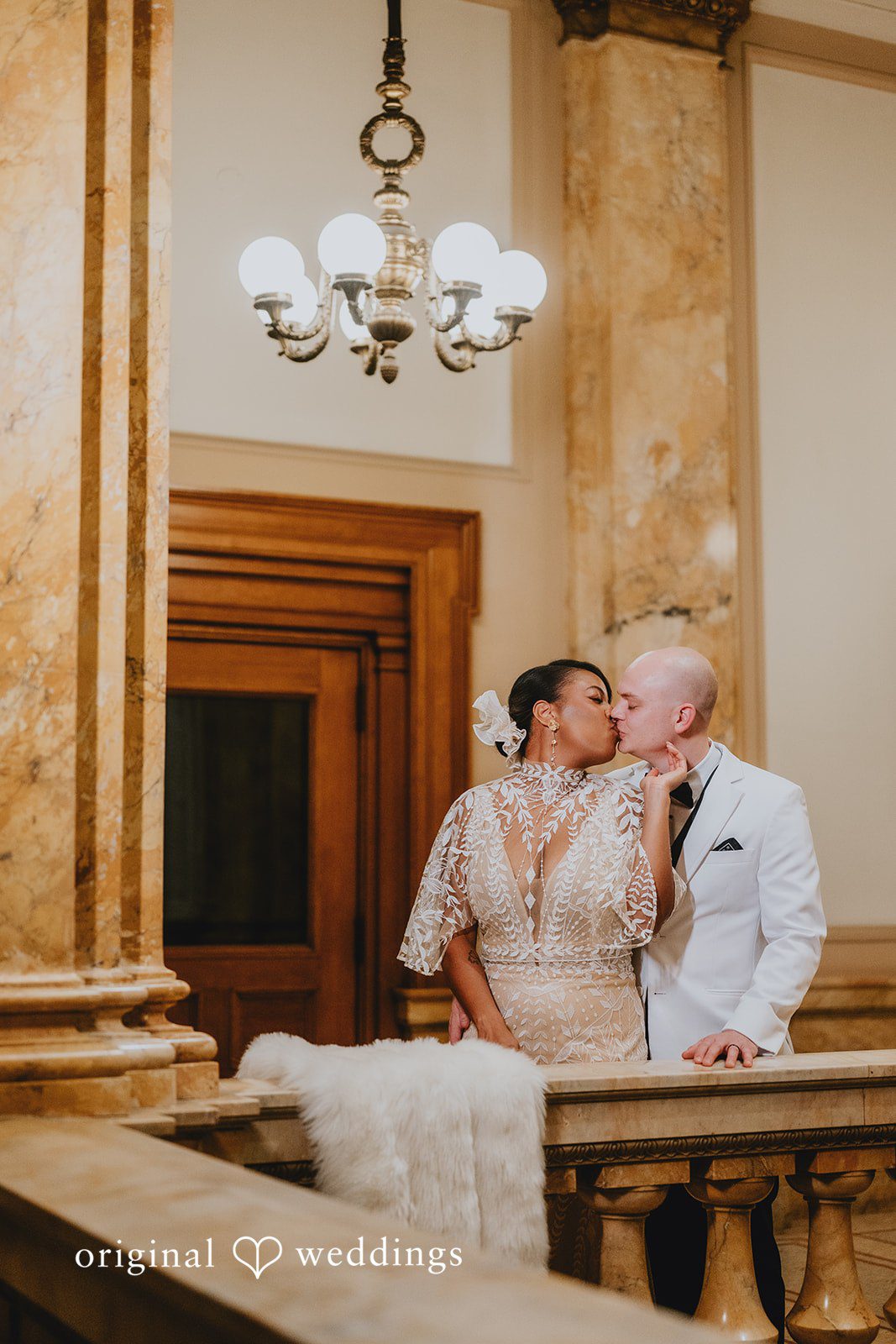 The couple shares a kiss