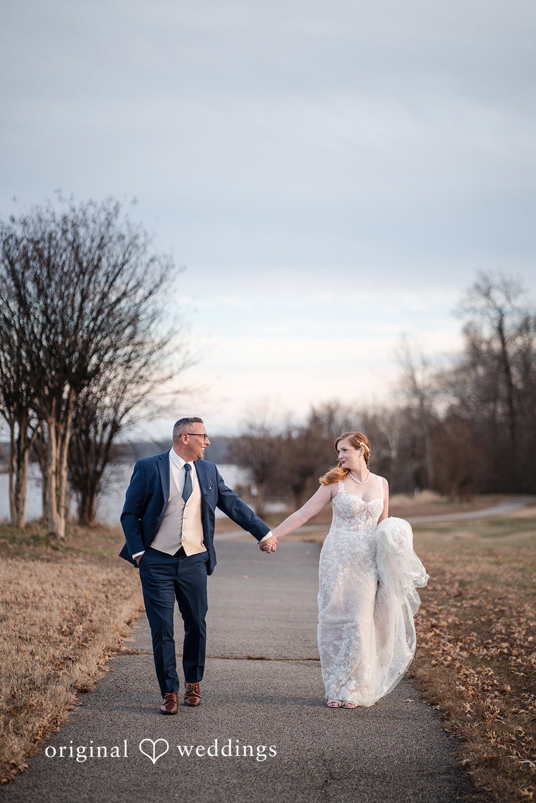 Caitlyn + Greg Intimate moment with soft greenery in the background.