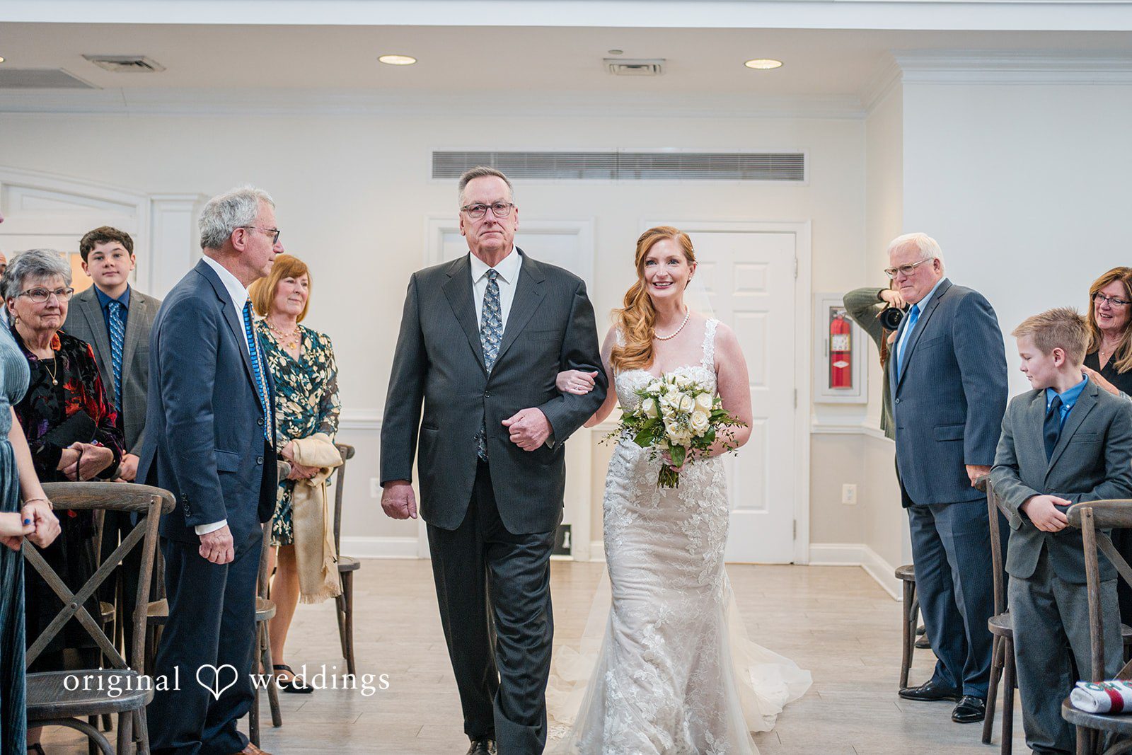 December 21, 2025 – Caitlyn & Greg – (ID-3654) Bride walking down the aisle with guests watching.