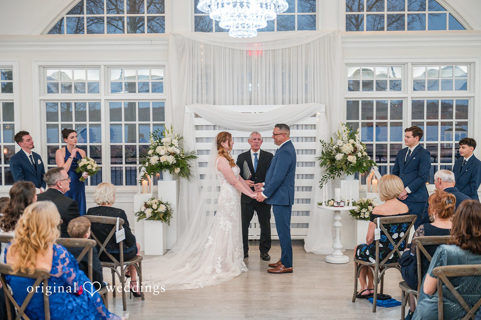 Caitlyn + Greg Close-up of couple holding hands during an intimate moment at The Osprey’s at Belmont Bay