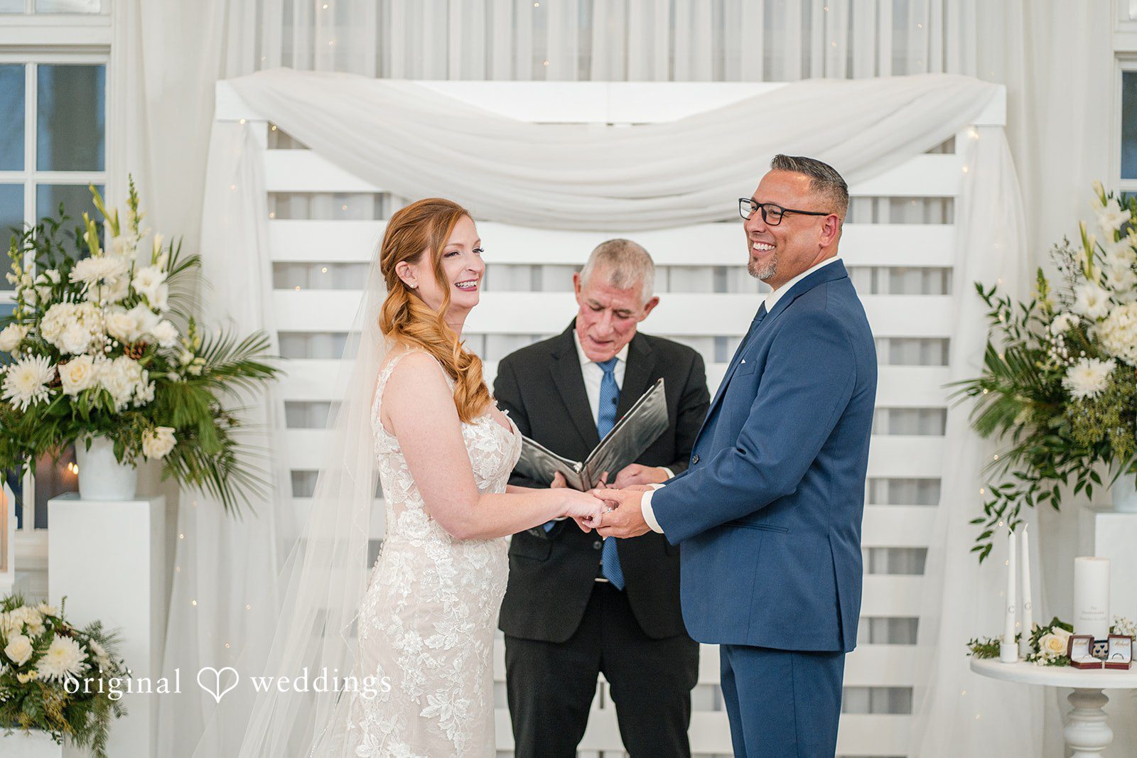 Caitlyn + Greg Close-up of couple holding hands during an intimate moment.