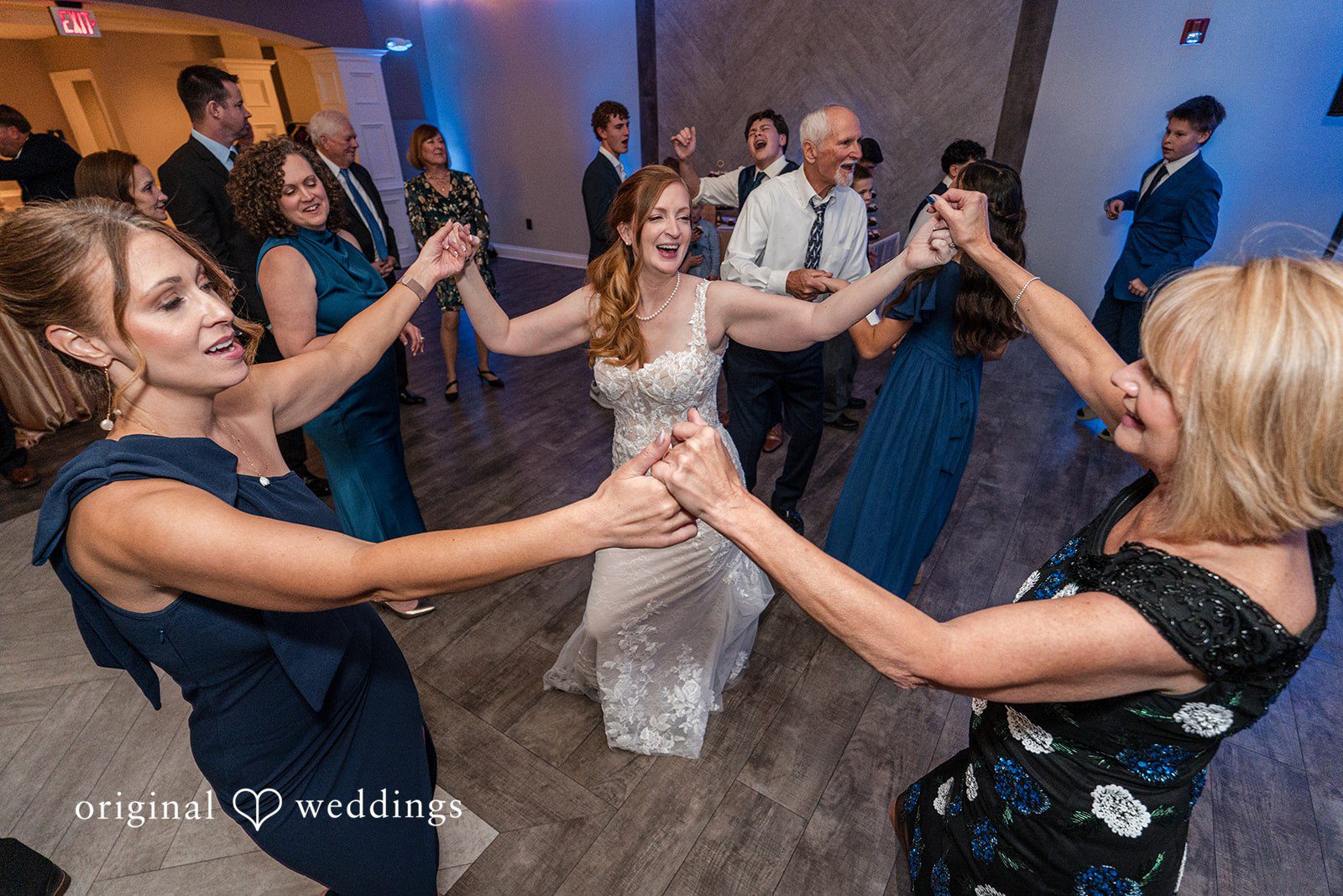 Caitlyn + Greg Bride dance with bridesmaid