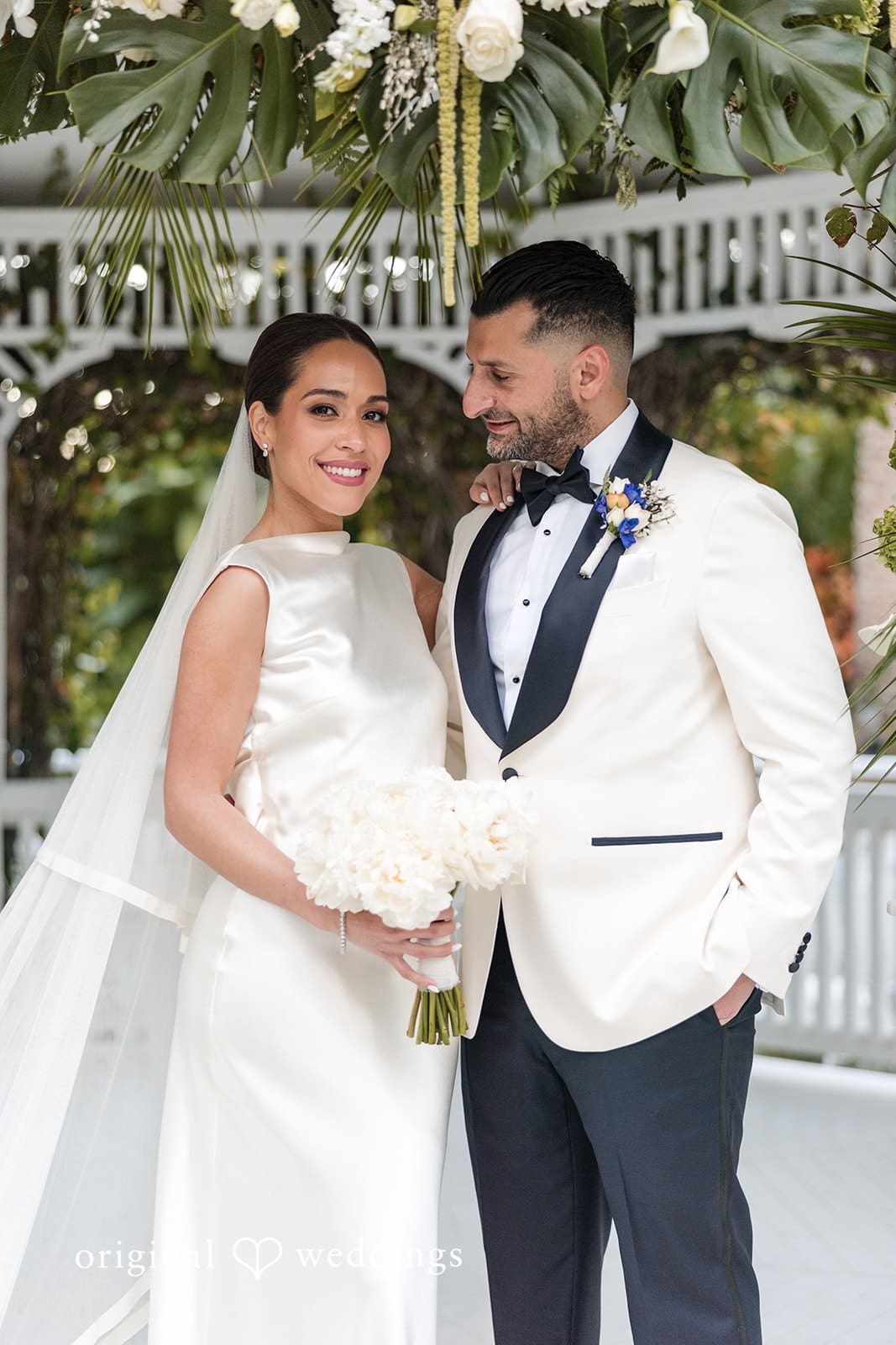 Groom posing and looking at bride during wedding photos at The Palms Hotel & Spa
