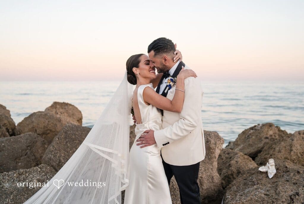 Romantic kiss moment of the couple at The Palms Hotel & Spa by Miami wedding photographer from original weddings