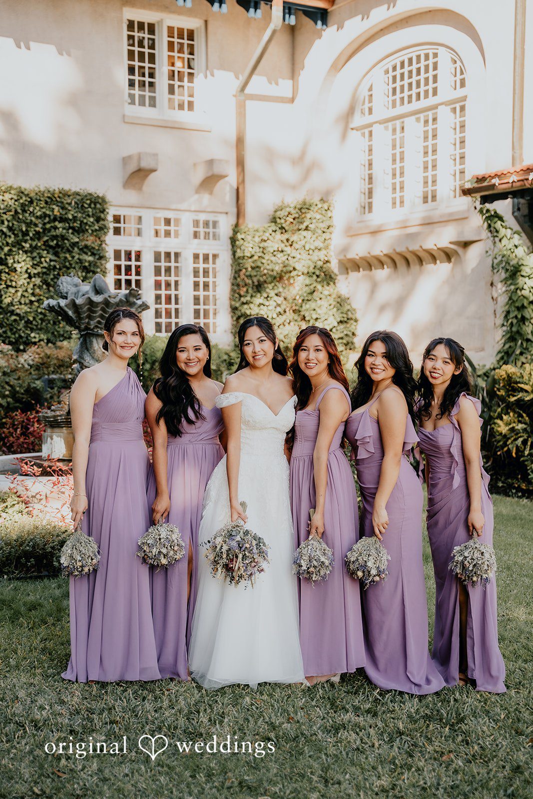 Bridesmaids pose together in coordinated elegance.