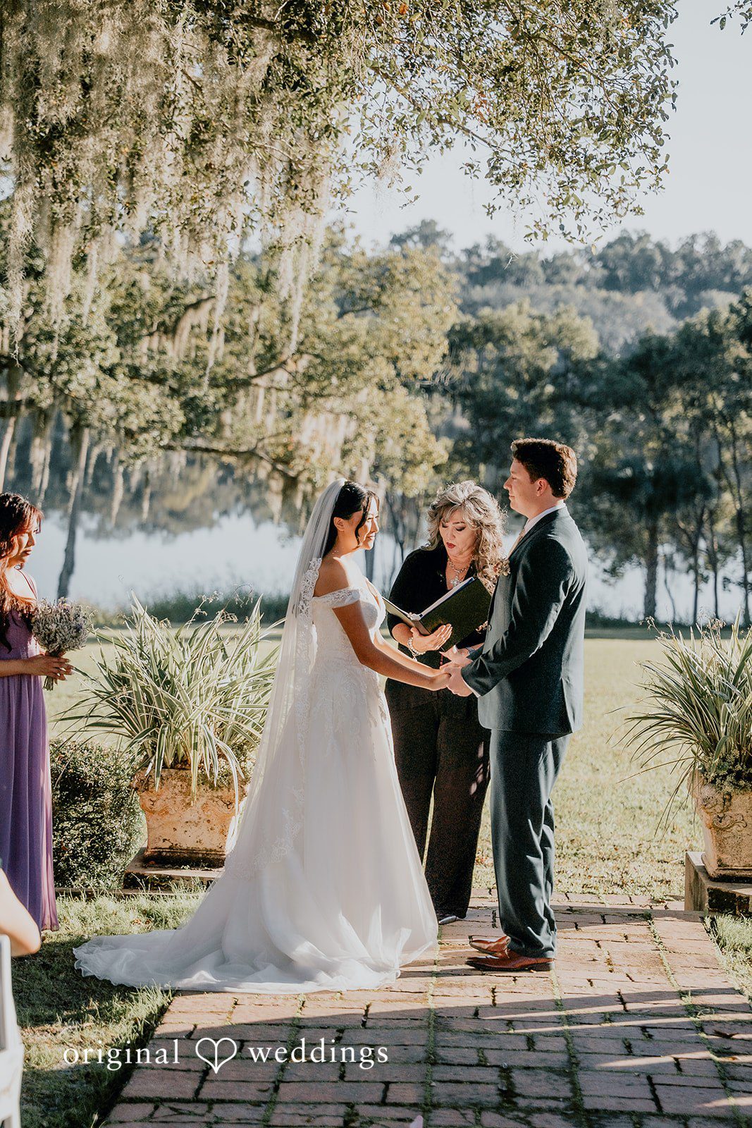 The groom leads the bride in a romantic walk together.