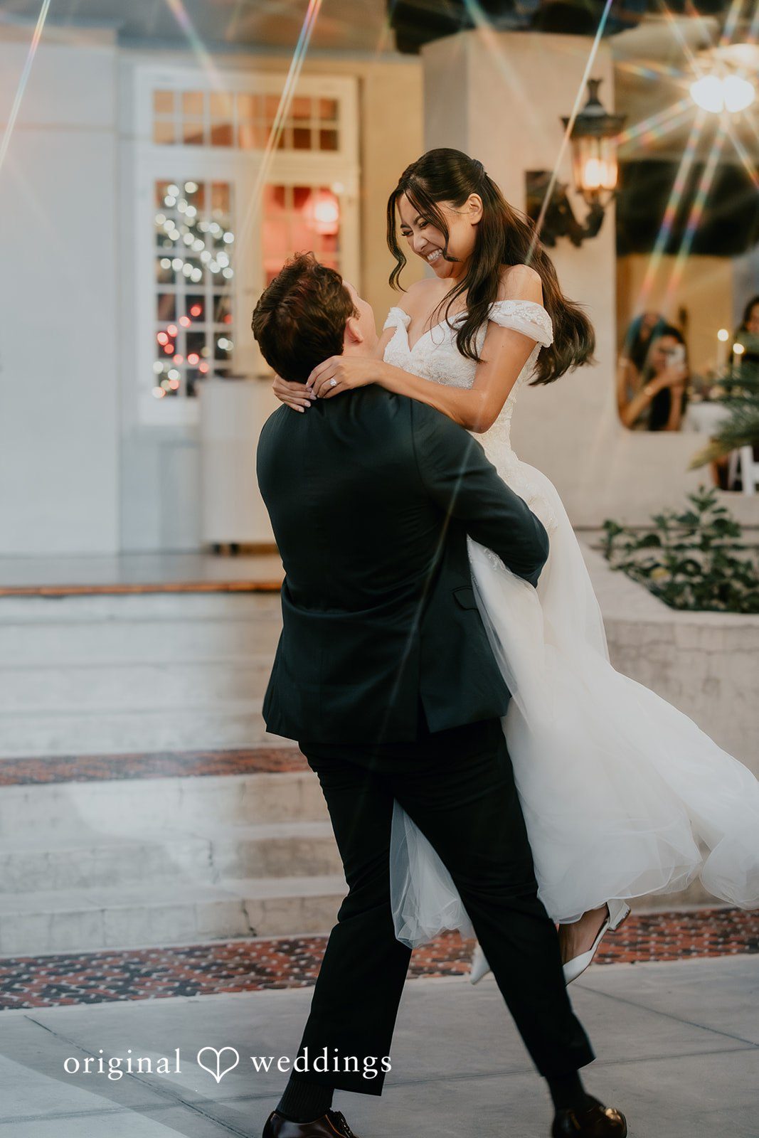 Trisha + Jacob The couple shares a playful and joyful moment together.