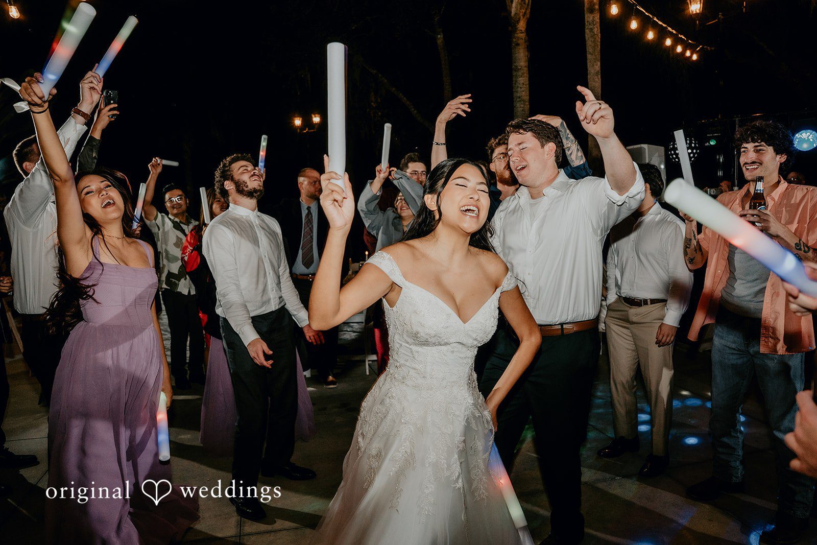 Guests celebrate joyfully on the dance floor.