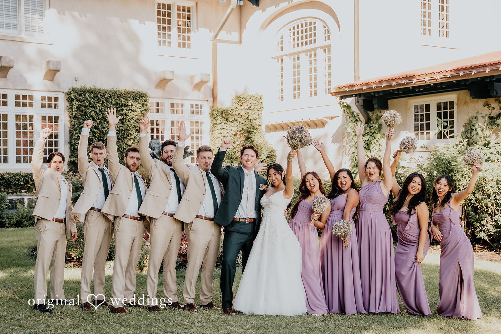 The wedding party poses together in perfect harmony.