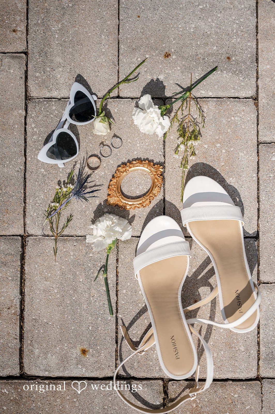 Wedding details like shoes and accessories are elegantly displayed.