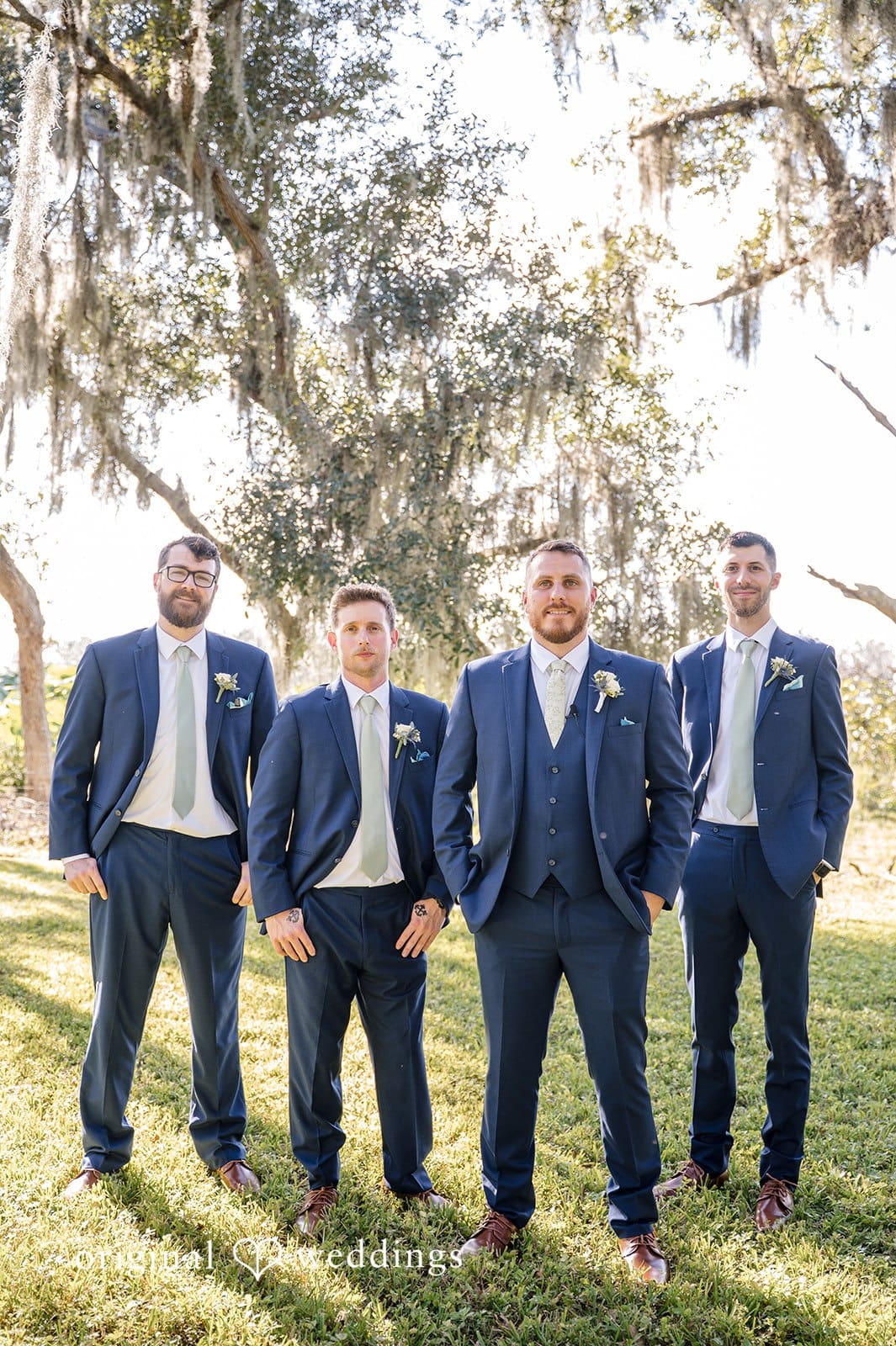 The groom and his friends pose together with confidence and unity.