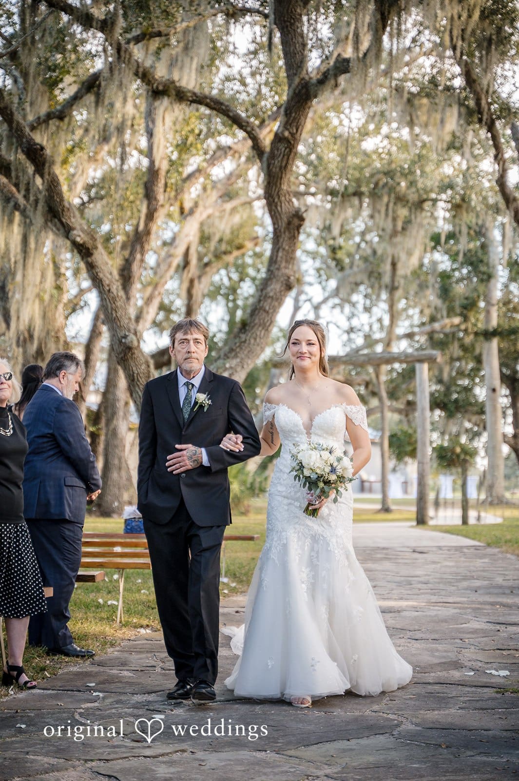 The bride and groom focus on each other with loving gazes during the ceremony.