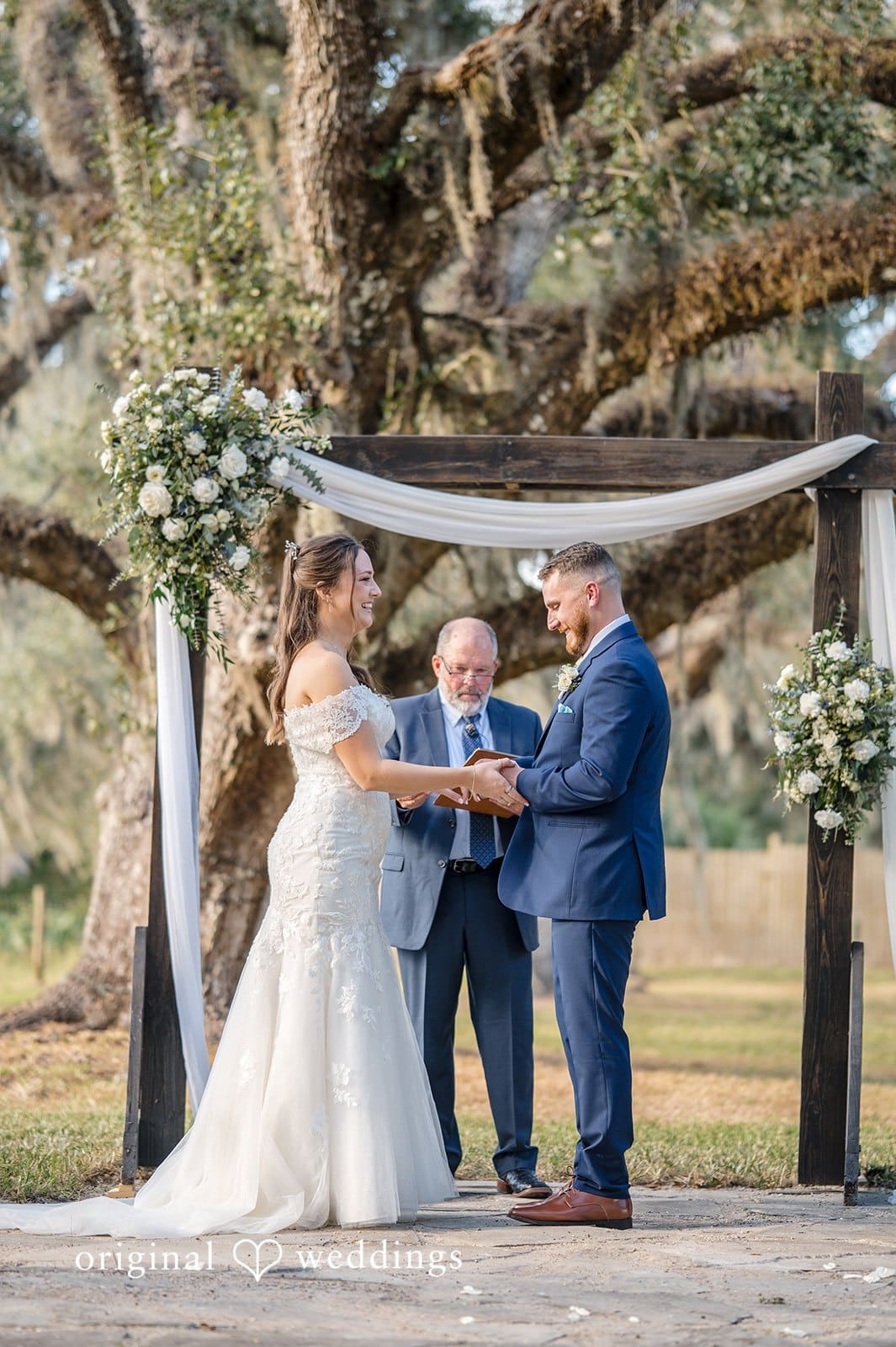 The wedding ceremony takes place in an intimate setting.