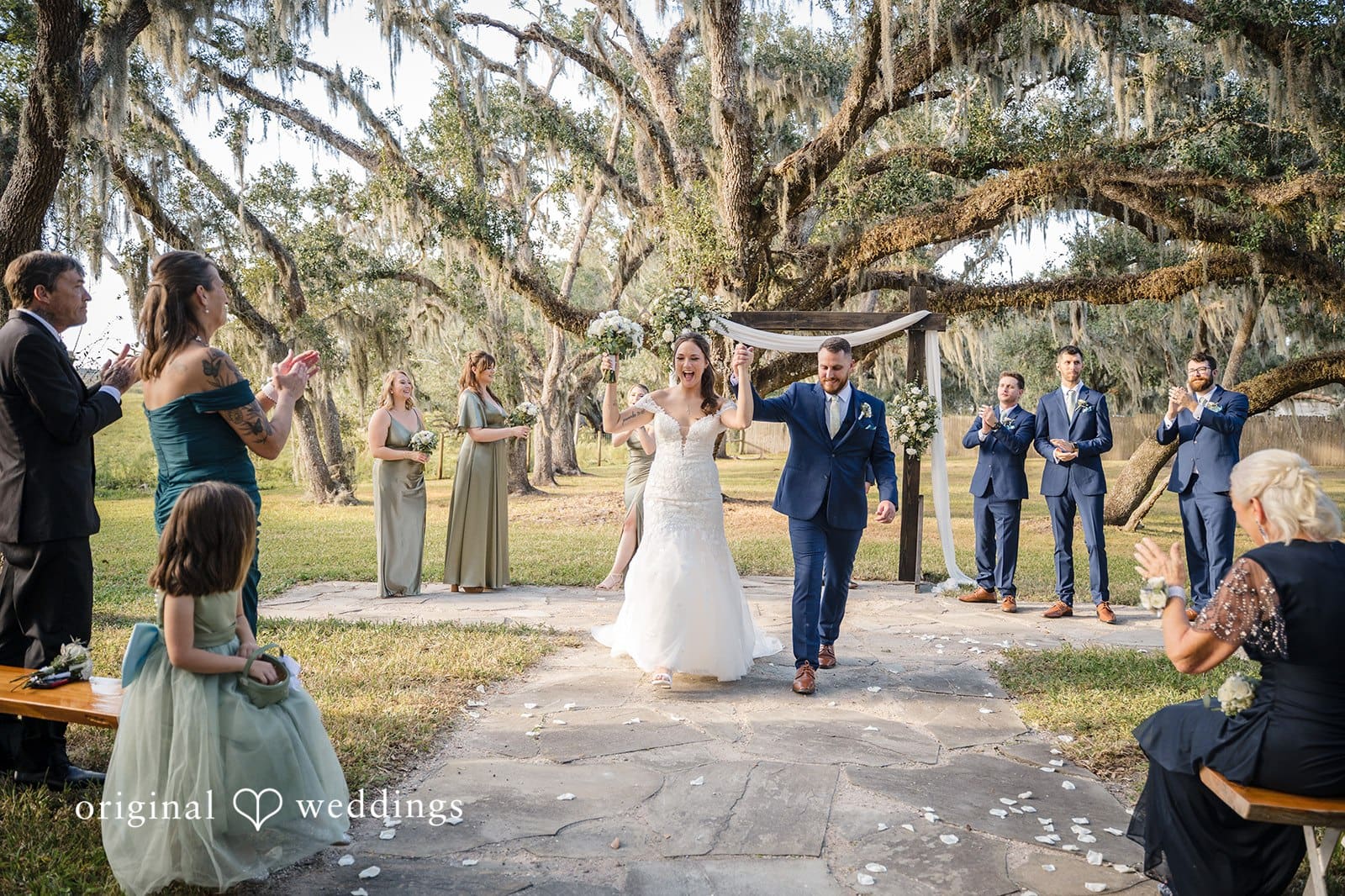 The bride shares a joyful dance moment with her loved ones.