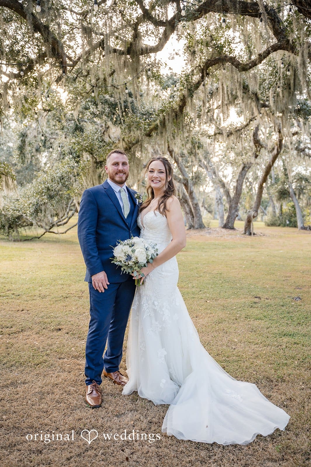 The couple poses during a romantic walk in nature.