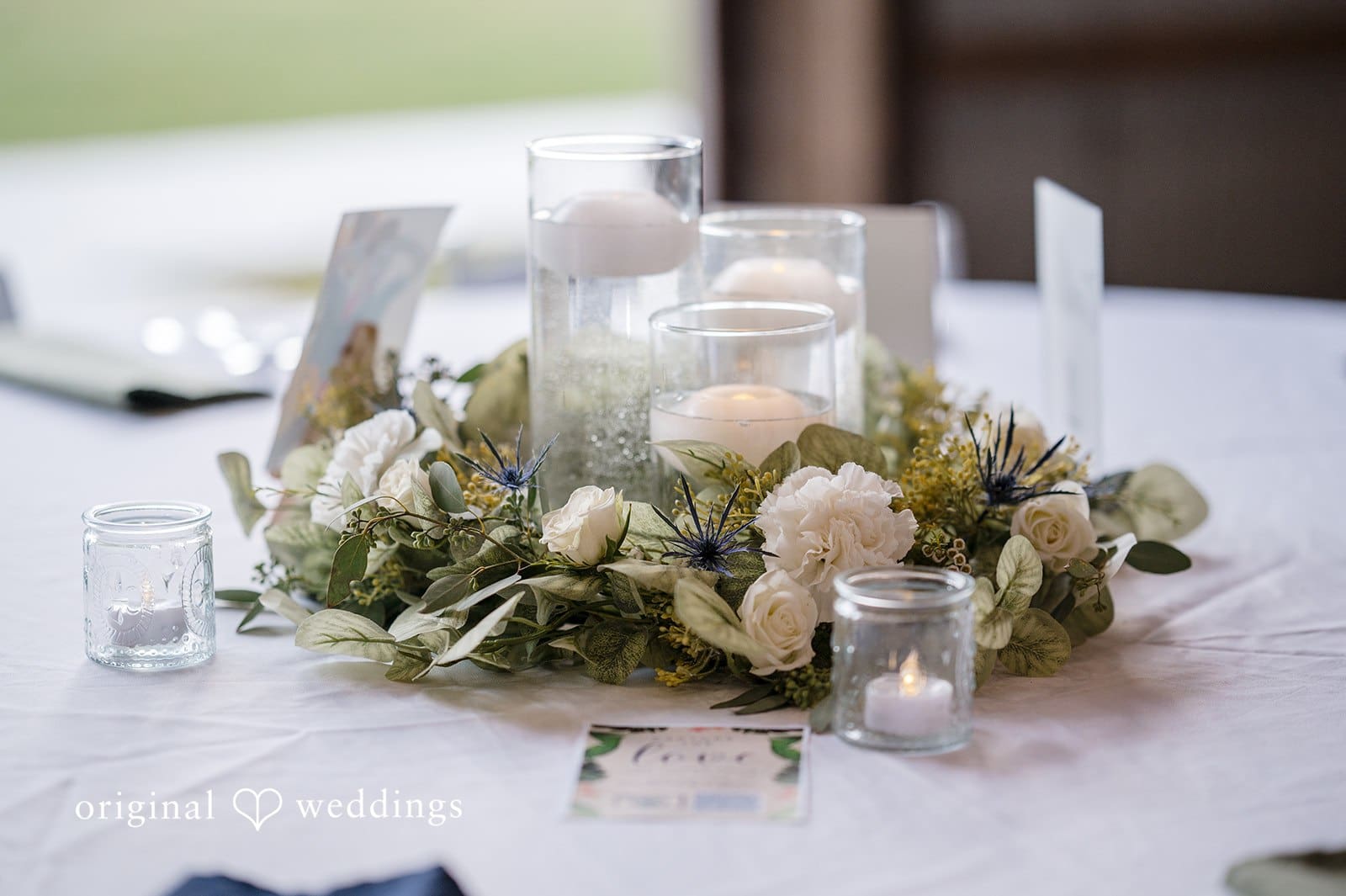 Table decor with candles and flowers creates a romantic ambiance.