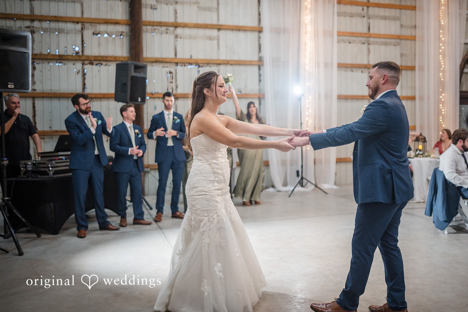 The couple joins hands as they unite their lives during the ceremony.
