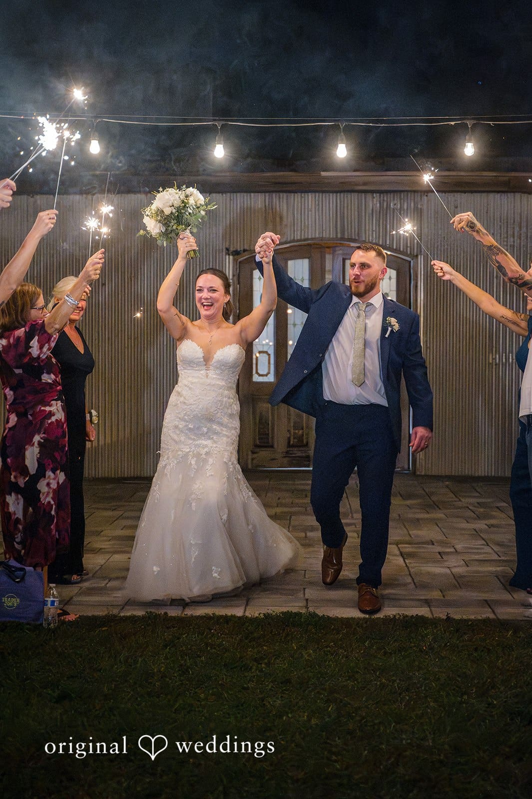 The bride and groom make a fun entrance to start the celebration.