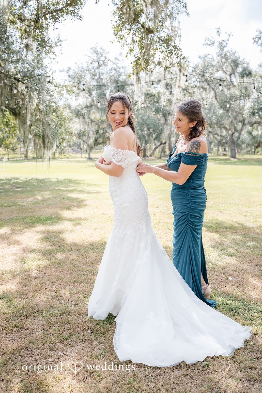 The bride shares a joyful and harmonious moment with her bridesmaids.