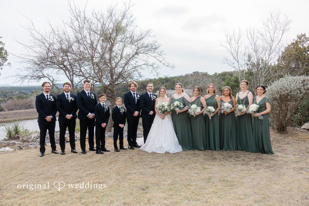 Our Austin wedding photographers at Original Weddings captured a beautiful portrait of the couple and their bridal party at the outdoor area of The Videre Estate