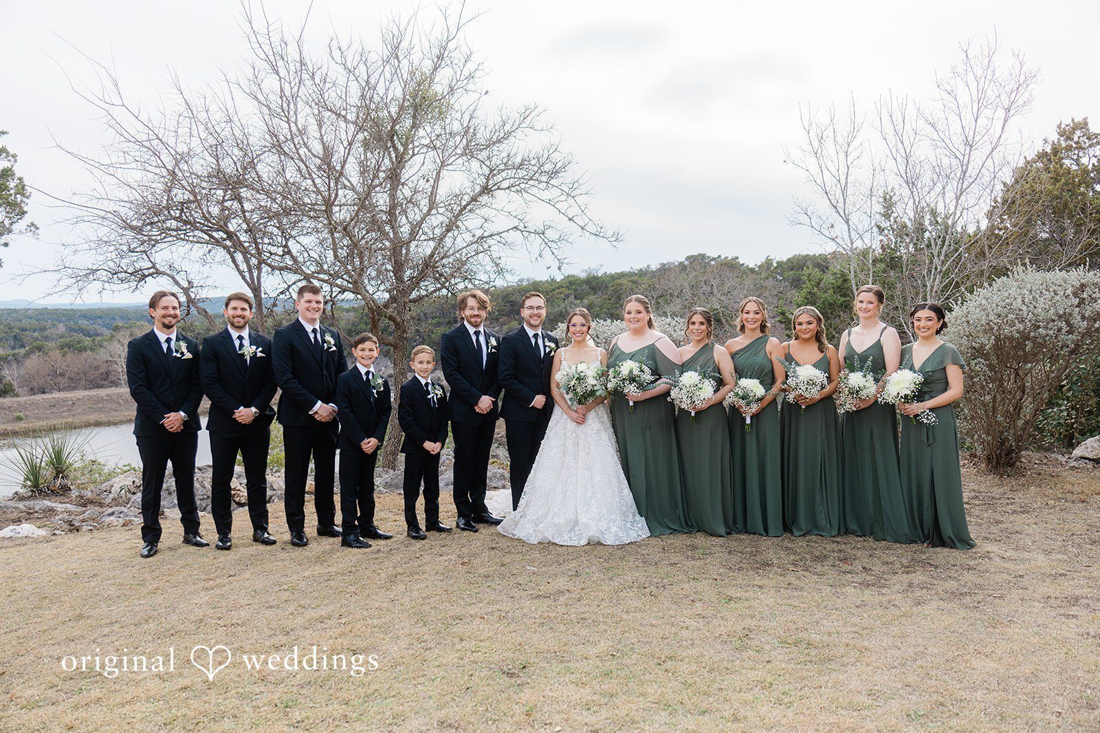 Our Austin wedding photographers at Original Weddings captured a beautiful portrait of the couple and their bridal party at the outdoor area of The Videre Estate