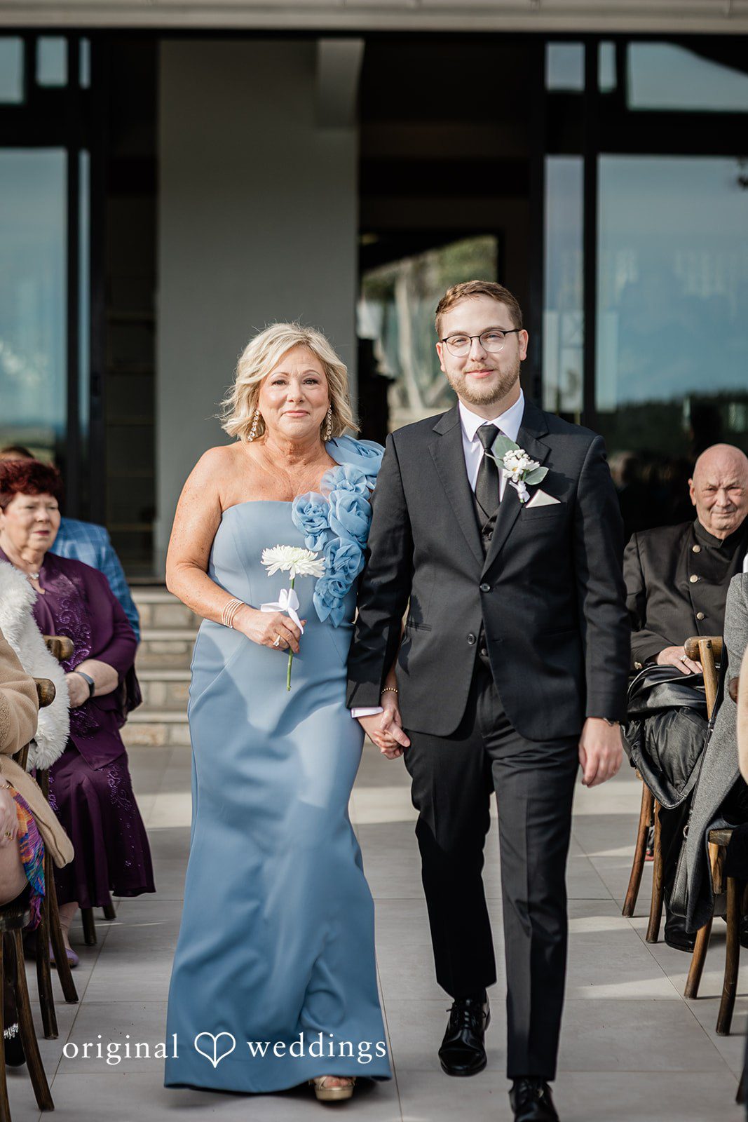 An emotional moment the groom's mother walked the groom down the aisle