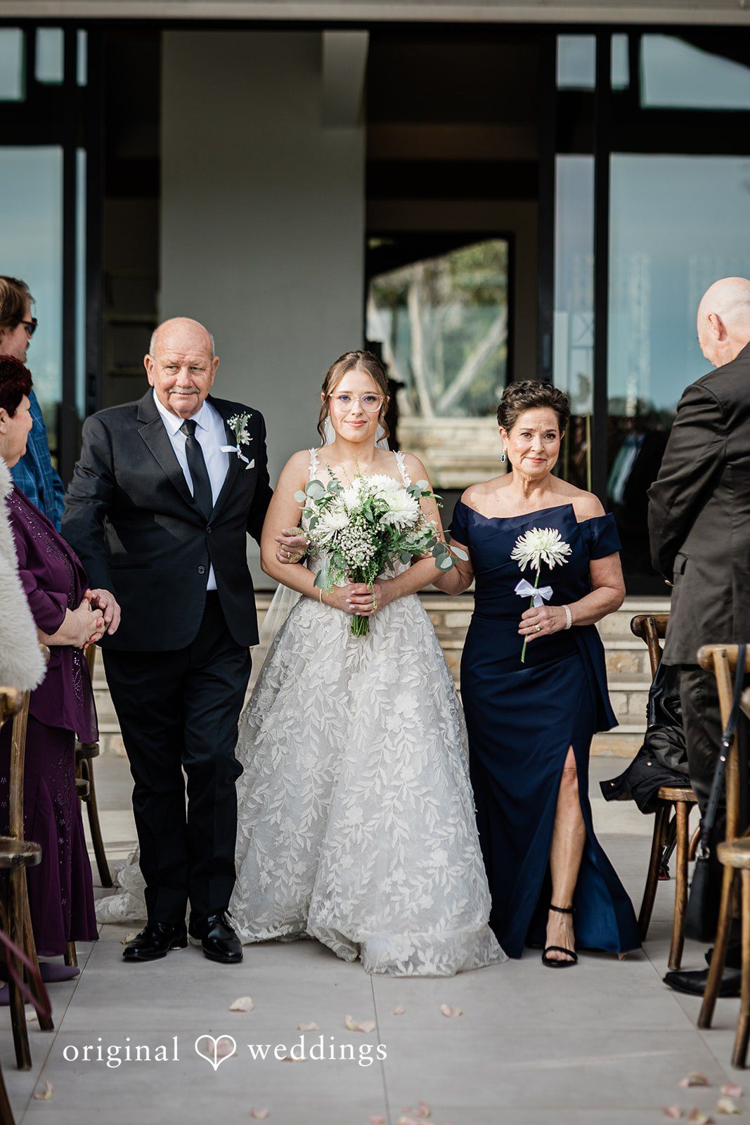 The beautiful moment the bride's parents walked the bride down the aisle