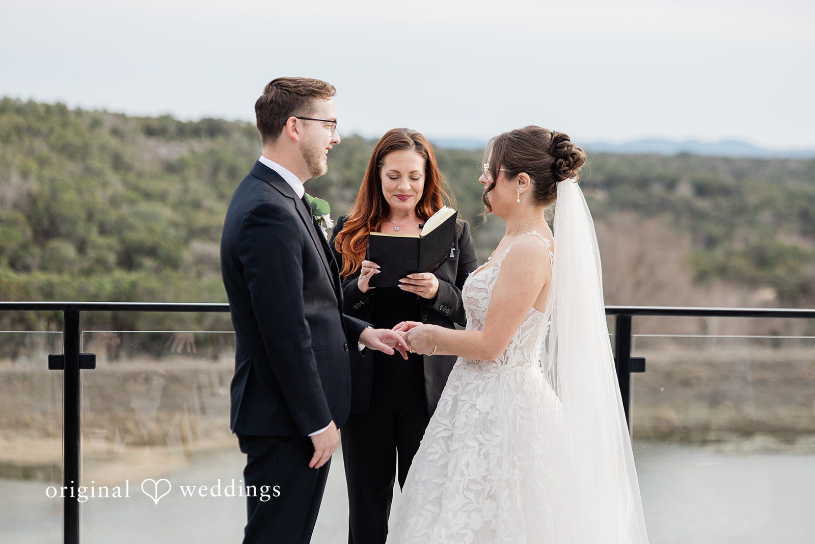 The bride and groom exchanging wedding rings