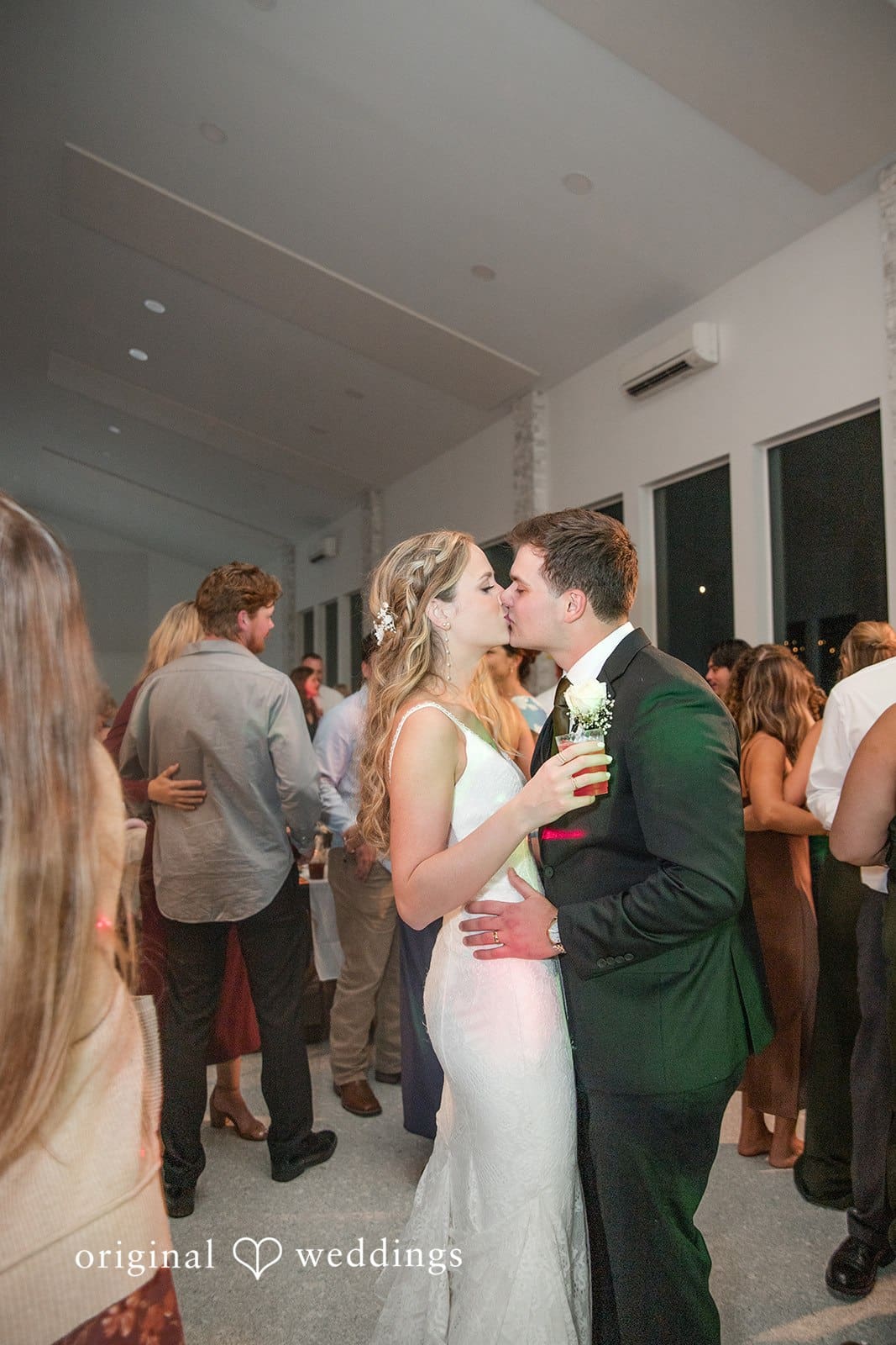 Brianne + Luke Bride and groom share a romantic kiss during their wedding dance