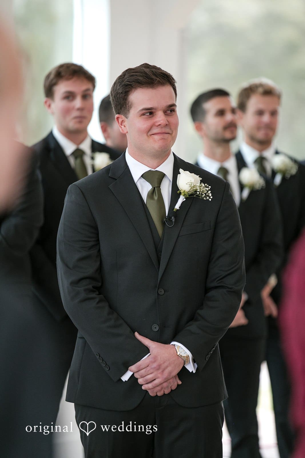 Brianne + Luke Groom waiting at altar with groomsmen