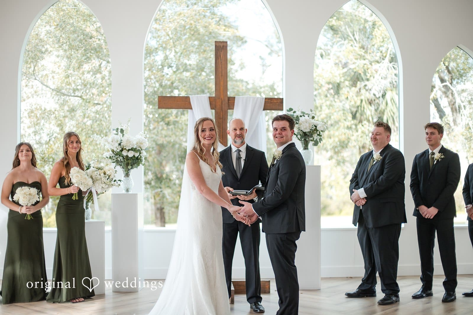 Brianne + Luke Wedding couple sharing a loving moment holding hands