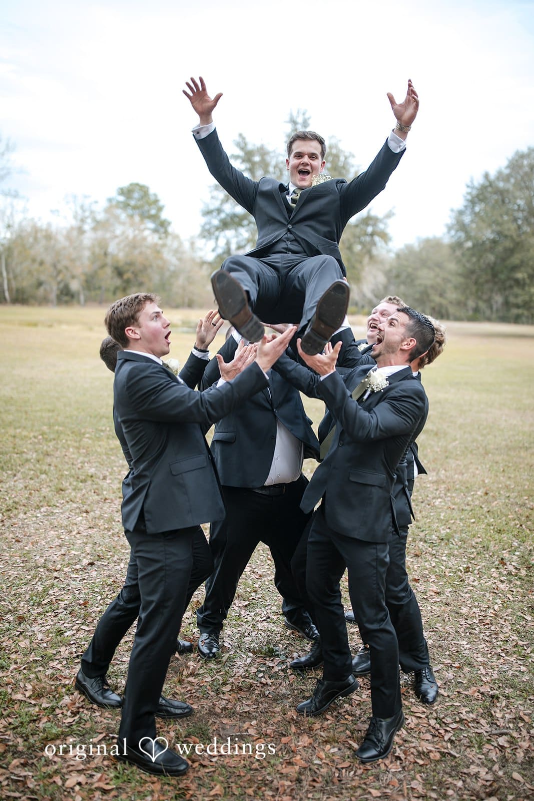 Brianne + Luke Groom lifted joyfully by groomsmen before wedding ceremony