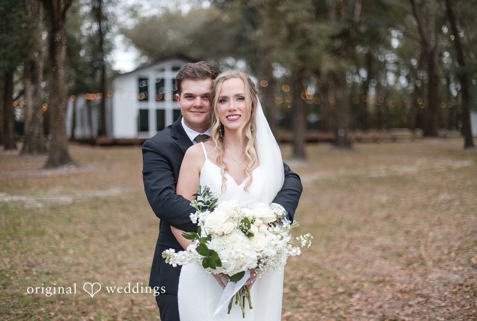 Newlyweds sharing a loving gaze at The Whitewood Ranch photographed by Orlando Wedding Photographers from Original Weddings