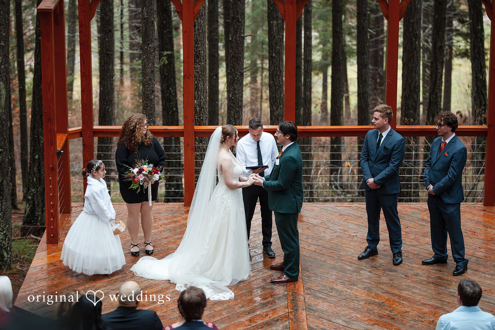 A portrait of the bride and groom exchanging marital vows at Tierra Retreat Center