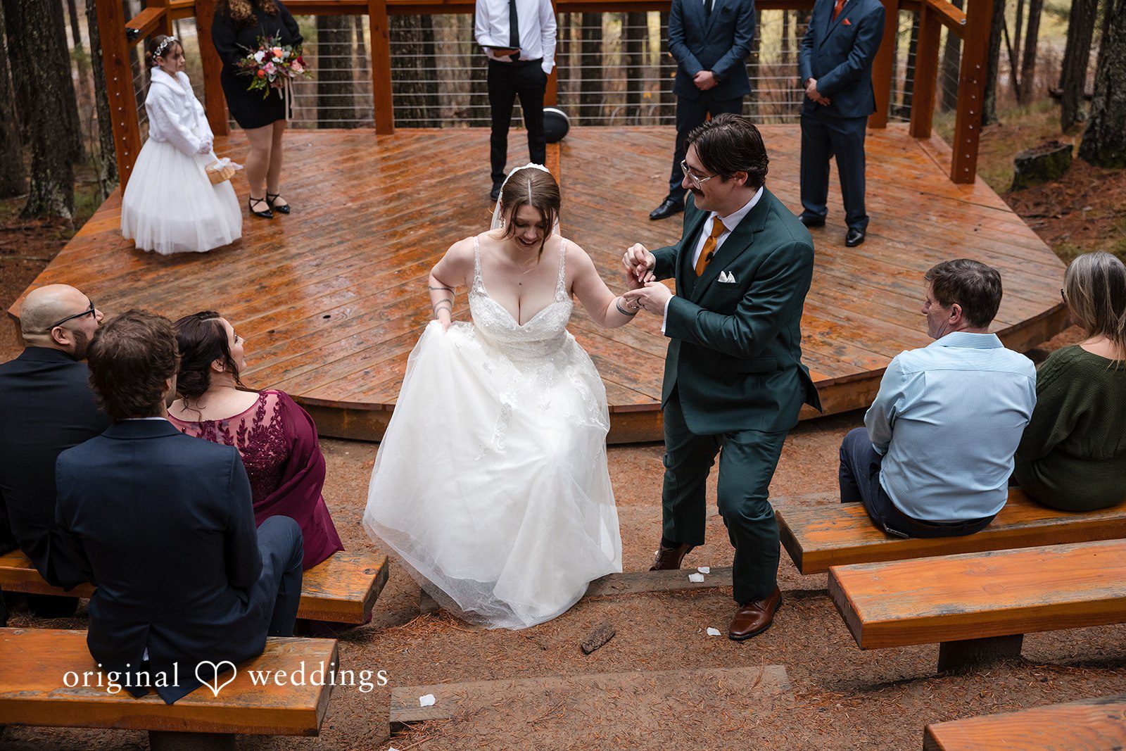 The couple exits the podium after a successful wedding ceremony